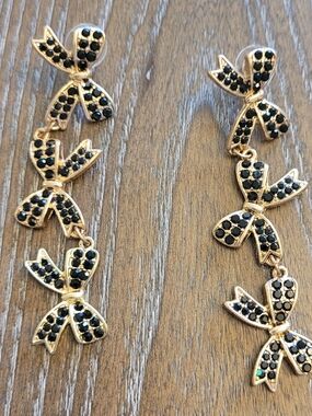 Gold Bow Drop Earrings with Black Stone Details